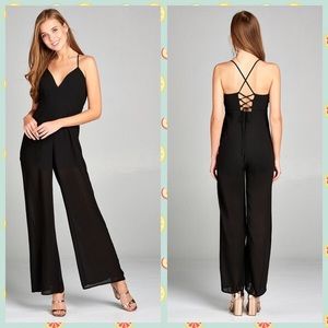 Trendy jumper w/plunging v-neck and cami strap.